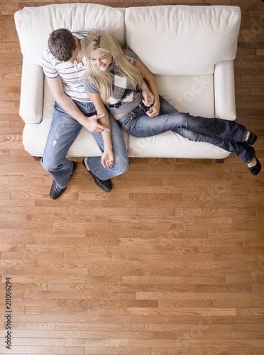 Photo: Overhead View of Couple on Love Seat Overhead View of Couple on Love Seat