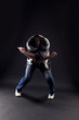 cool man modern dancer against black
