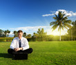 happy young businessman and sunset