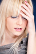blond woman having headache
