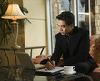 Photo: Young Businessman using Laptop Young Businessman using Laptop