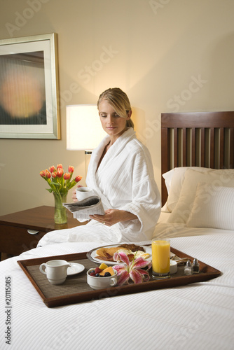 Photo: Woman With Hotel Room Service Woman With Hotel Room Service