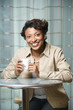 Smiling Woman with Coffee Cup