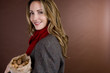 A woman holding a bag full of mixed nuts