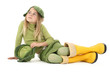 Enfant avec des bottes jaune et un choux sur la tête