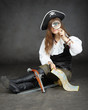 Girl pirate, and map with a magnifying glass on black background Girl pirate, and map with a magnifying glass on black background