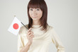 Photo: 日本国旗を持つ女性 日本国旗を持つ女性