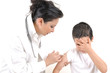 Pediatrician giving an injection in arm to a little boy