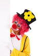funny clown holding a banner