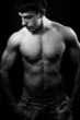 Dark portrait of man with muscular body