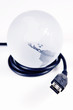 USB cable around globe on white