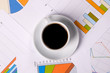 Work-table covered with documents and coffee Work-table covered with documents and coffee