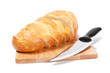 Chopped bread with knife on wooden utensil Chopped bread with knife on wooden utensil