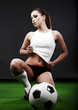 Sexy soccer player, woman on playing field