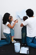 Foto: Loving parents helping their children paint Loving parents helping their children paint