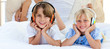 Close-up of siblings listening music