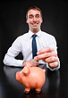 mann mit Sparschwein