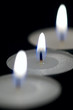 Three candles in the dark.