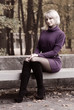 Young pretty girl relaxing in autumn park Young pretty girl relaxing in autumn park