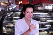 woman drinking a coffee at a pastry shop
