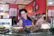 happy owner of a small business store/ pastry shop