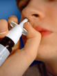 spraying nose spray