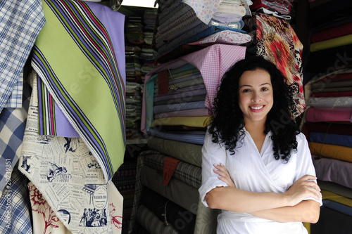 Photo: happy owner of a fabric store happy owner of a fabric store