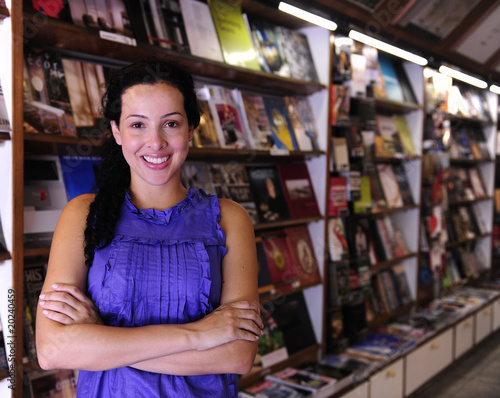 Photo: happy owner of a bookstore happy owner of a bookstore
