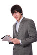 Foto: Young businessman or student with notepad Young businessman or student with notepad