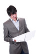 Foto: Shocked young businessman with financial accounts Shocked young businessman with financial accounts