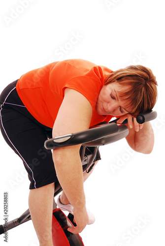 Photo: Woman exhausted after workout Woman exhausted after workout