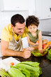 father and son cooking