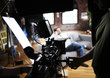 Foto: Cameraman operating digital cinema camera Cameraman operating digital cinema camera