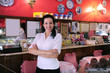 proud and confident owner of a cafe/ pastry shop