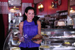 proud and confident owner of a cafe/ pastry shop