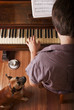 musician playing on a classical piano