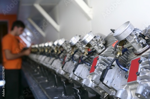 Photo: Engines from kart cars in row line for been inspected Engines from kart cars in row line for been inspected