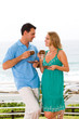 couple relaxing on balcony