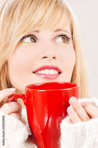 Photo: happy teenage girl with red mug happy teenage girl with red mug