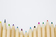 Colored pencils forming a color row. White background.