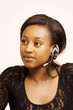 Receptionist with headphone listening attentively