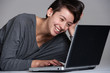 Young woman on floor with notebook