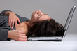 Young woman on floor with notebook