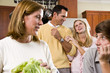 Close-up of family with two teenage children in kitchen