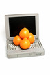 Laptop with oranges