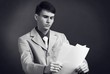 black and white dark studio portrait of business man