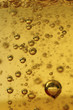 Air vials in a golden liquid. A background