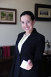 female lawyer at office giving business card