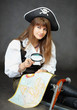 Girl - pirate sitting with a map and magnifying glass Girl - pirate sitting with a map and magnifying glass