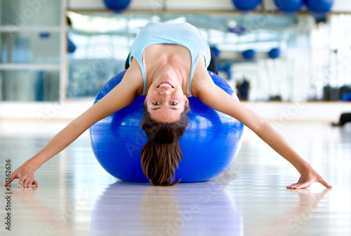 Photo: Gym woman bending backwards Gym woman bending backwards